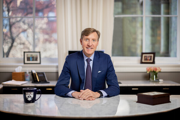 Interim President Jameson seated behind his desk in College Hall